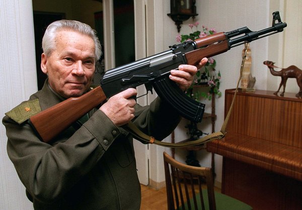 Lt. Gen. Mikhail T. Kalashnikov with a model of the AK-47 in 1997. (Vladimir Vyatkin/Associated Press)